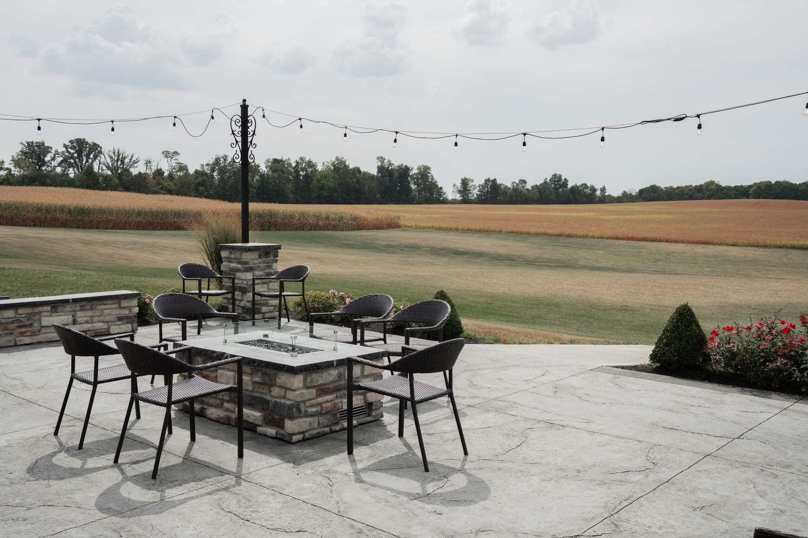 Outdoor terrace with aluminum frame dining tables and chairs set for service