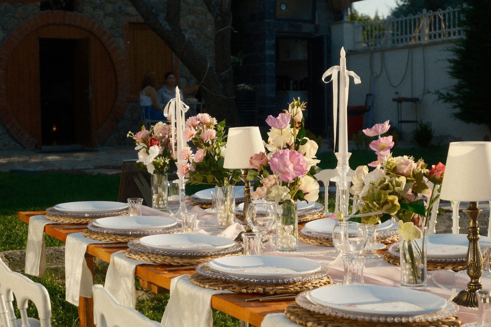 Garden dining table and chairs arranged on a lawn for outdoor entertaining