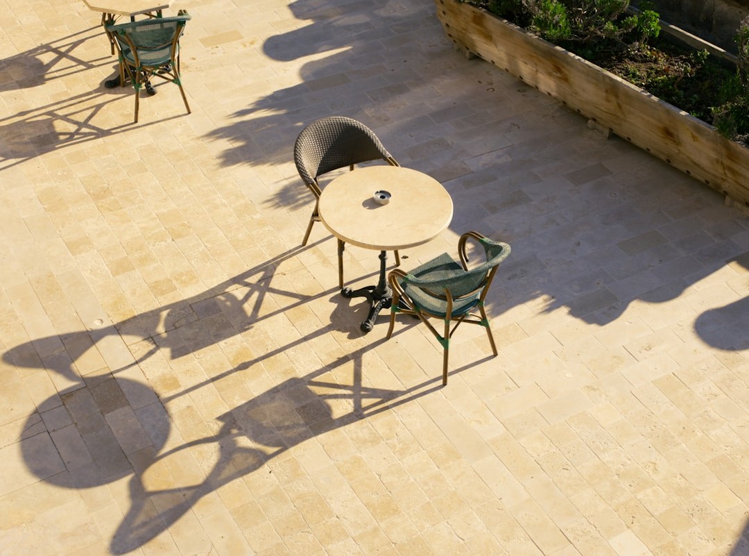 Outdoor patio with cushioned commercial furniture in a hospitality setting