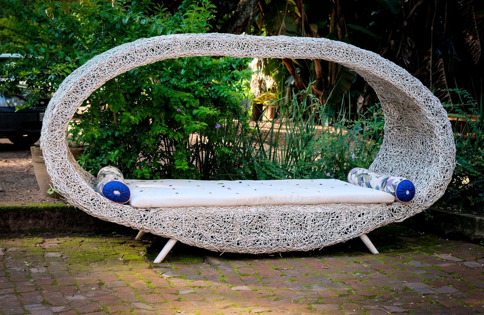 Rattan bench with cushions packed for a US container order from a China outdoor furniture factory