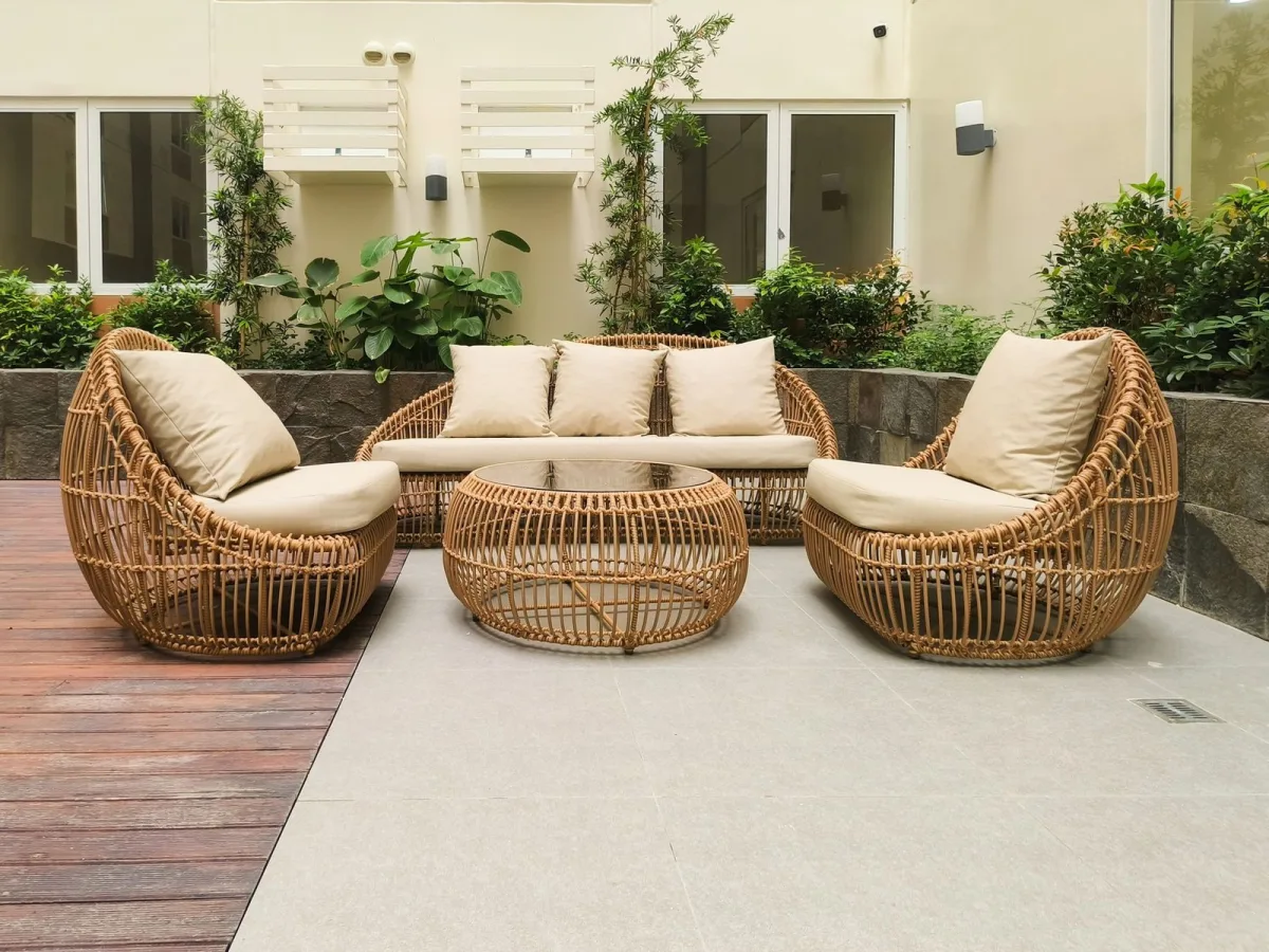 Commercial outdoor rattan furniture from a Chinese factory set in a hotel patio scene