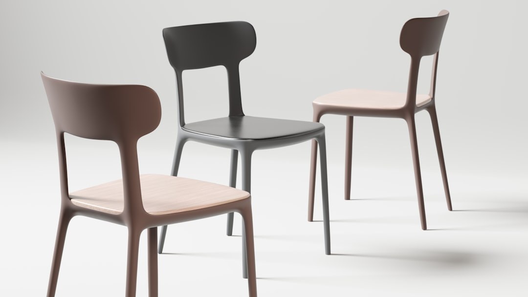 Modern outdoor chairs displayed for specification comparison in a furniture showroom