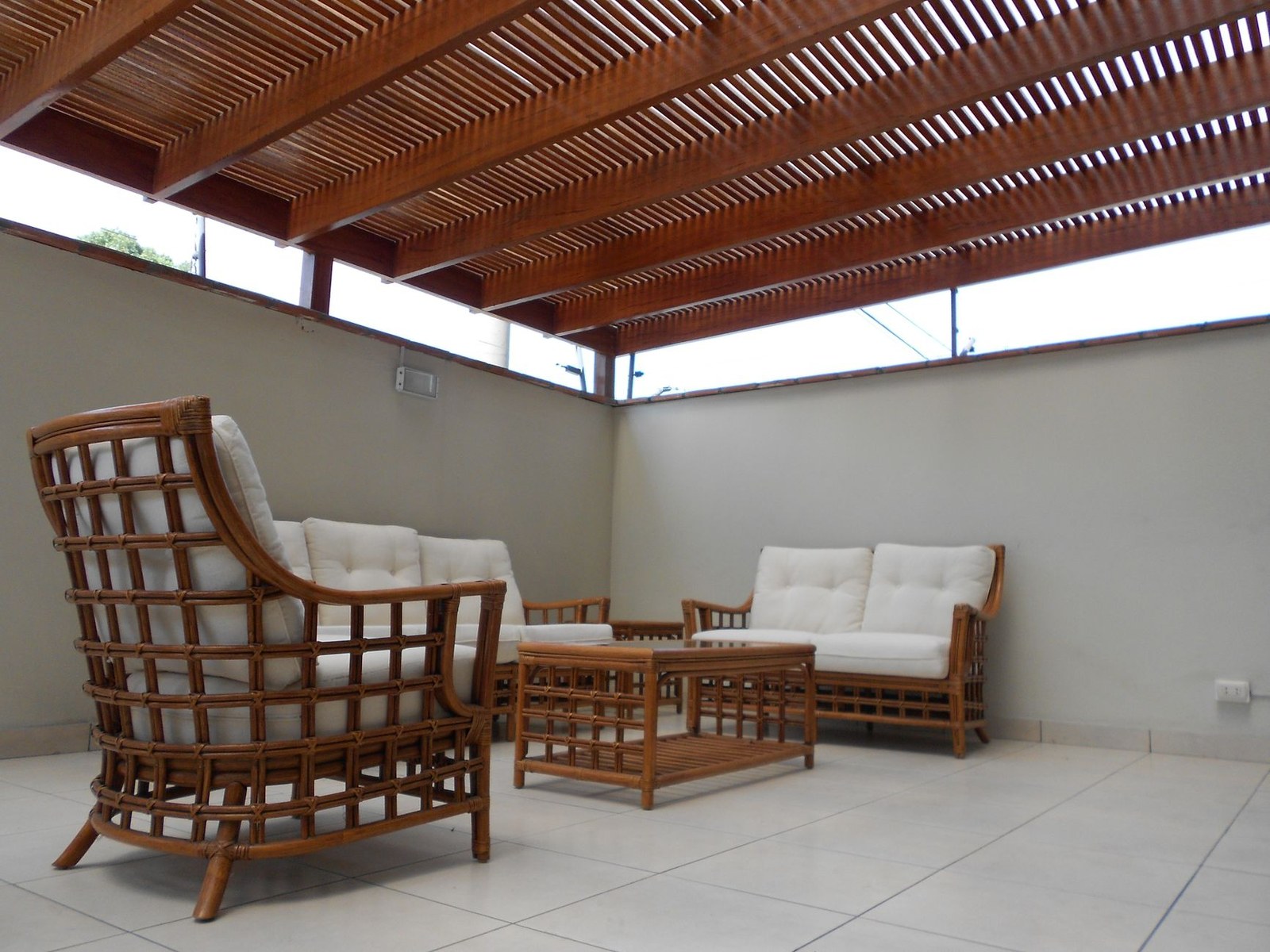 Stylish outdoor patio with rattan lounge seating