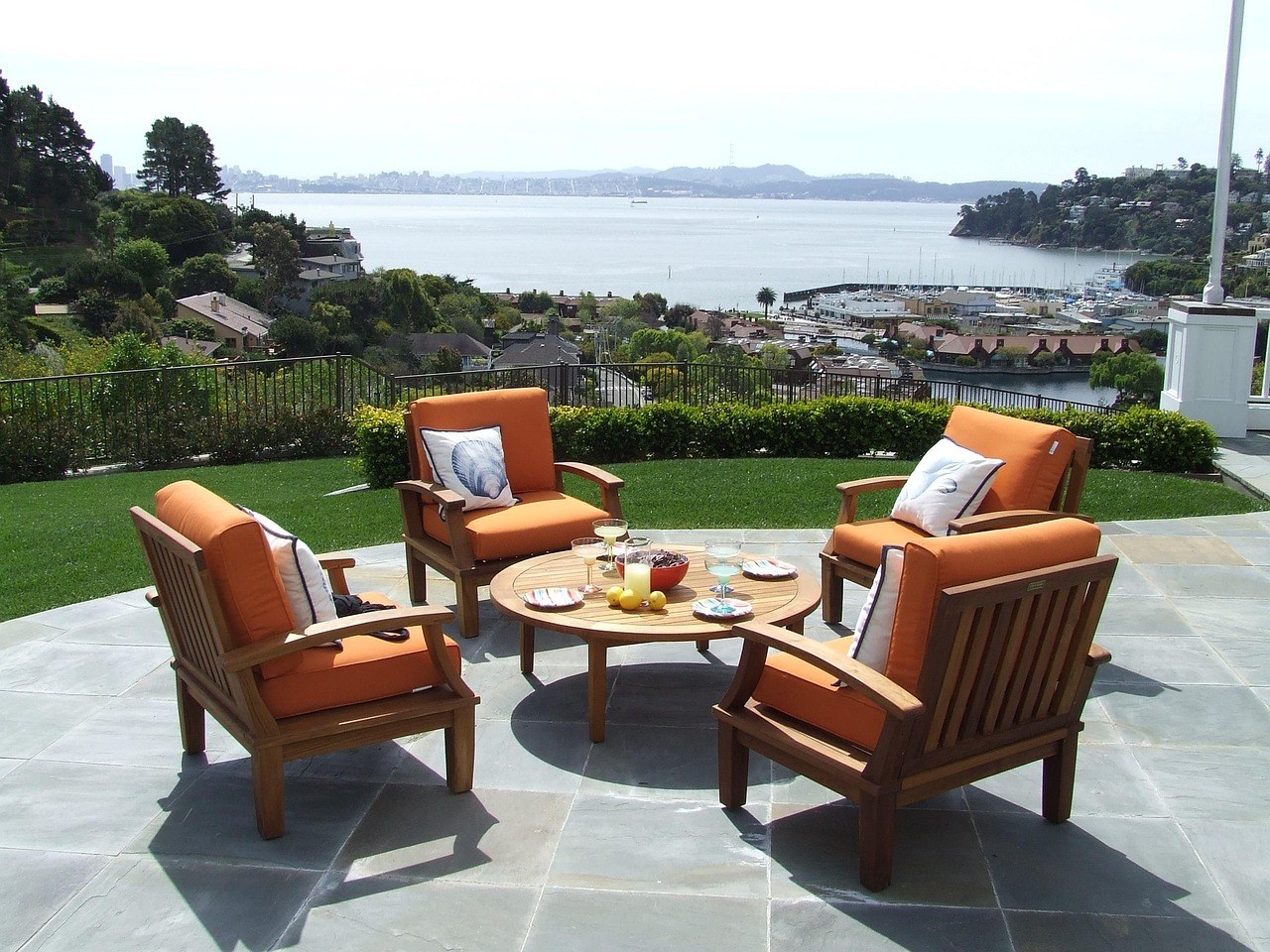 Commercial teak outdoor furniture set on a hotel terrace supplied by a Chinese factory