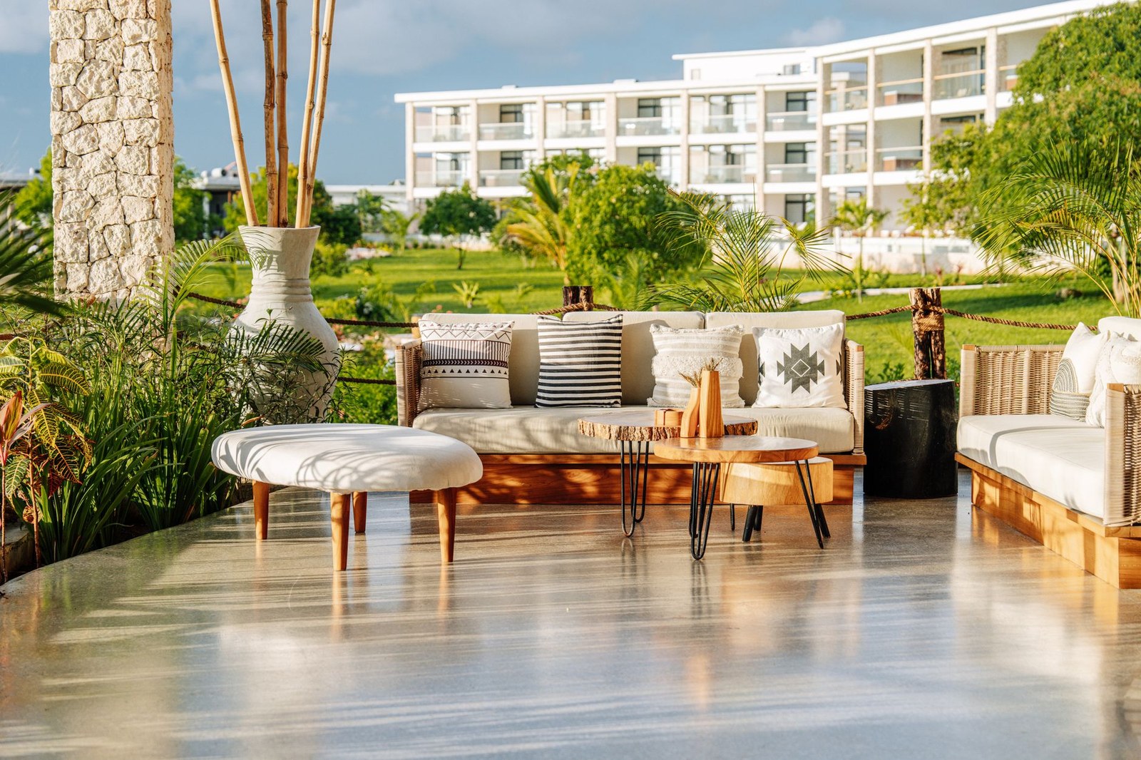Relaxing hotel patio dining area with commercial outdoor furniture
