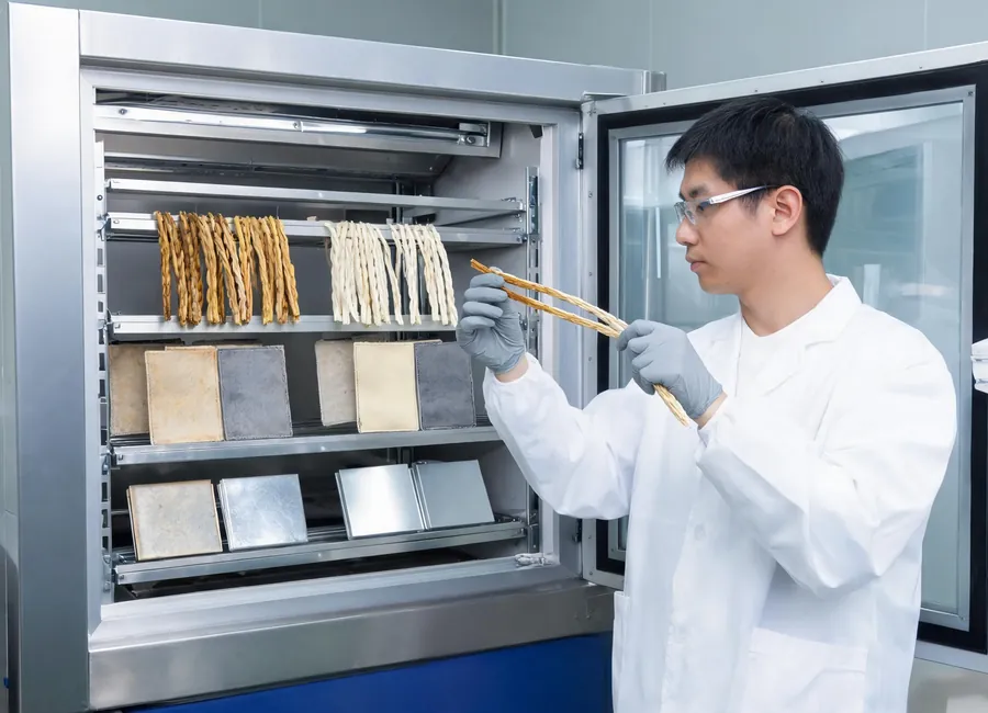 UV weathering tests for PE Rattan fabrics and powder-coated aluminum samples.