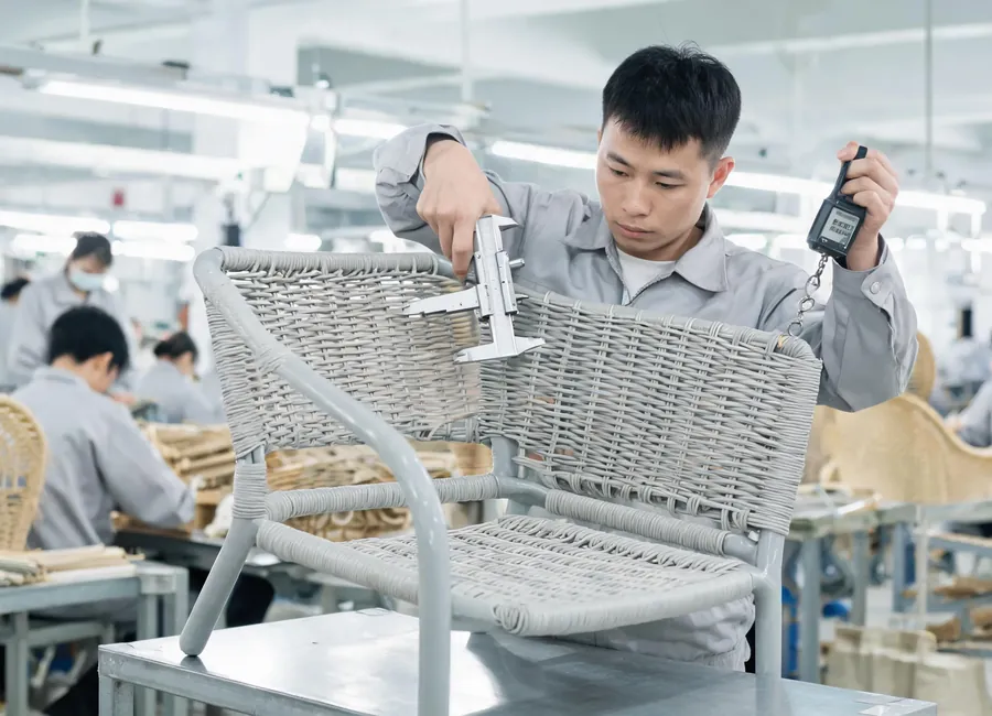 Quality control of PE Rattan weave tension and pattern stability.
